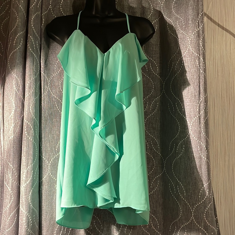 Maurice’s teal shirt